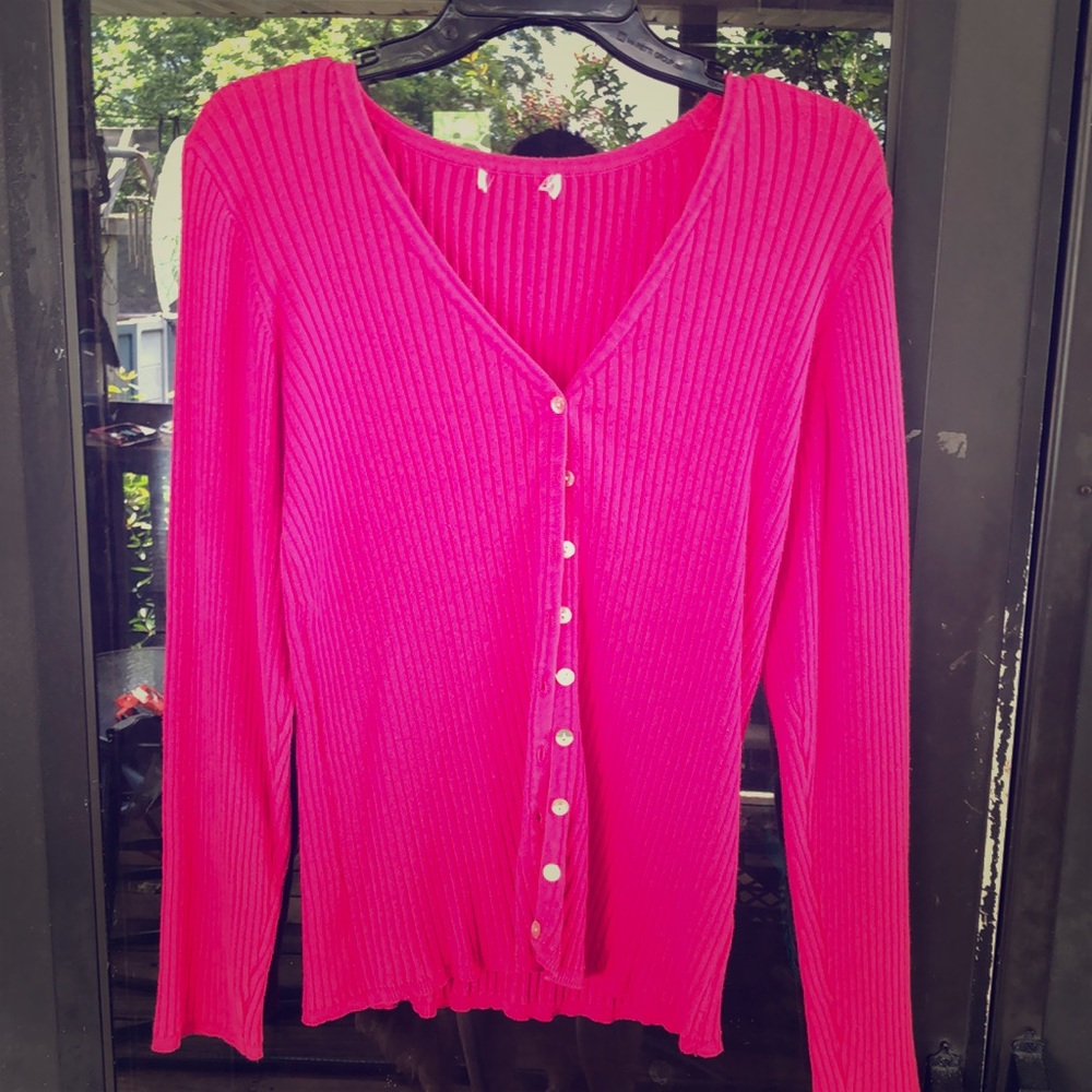 Pink cardigan sweater.
